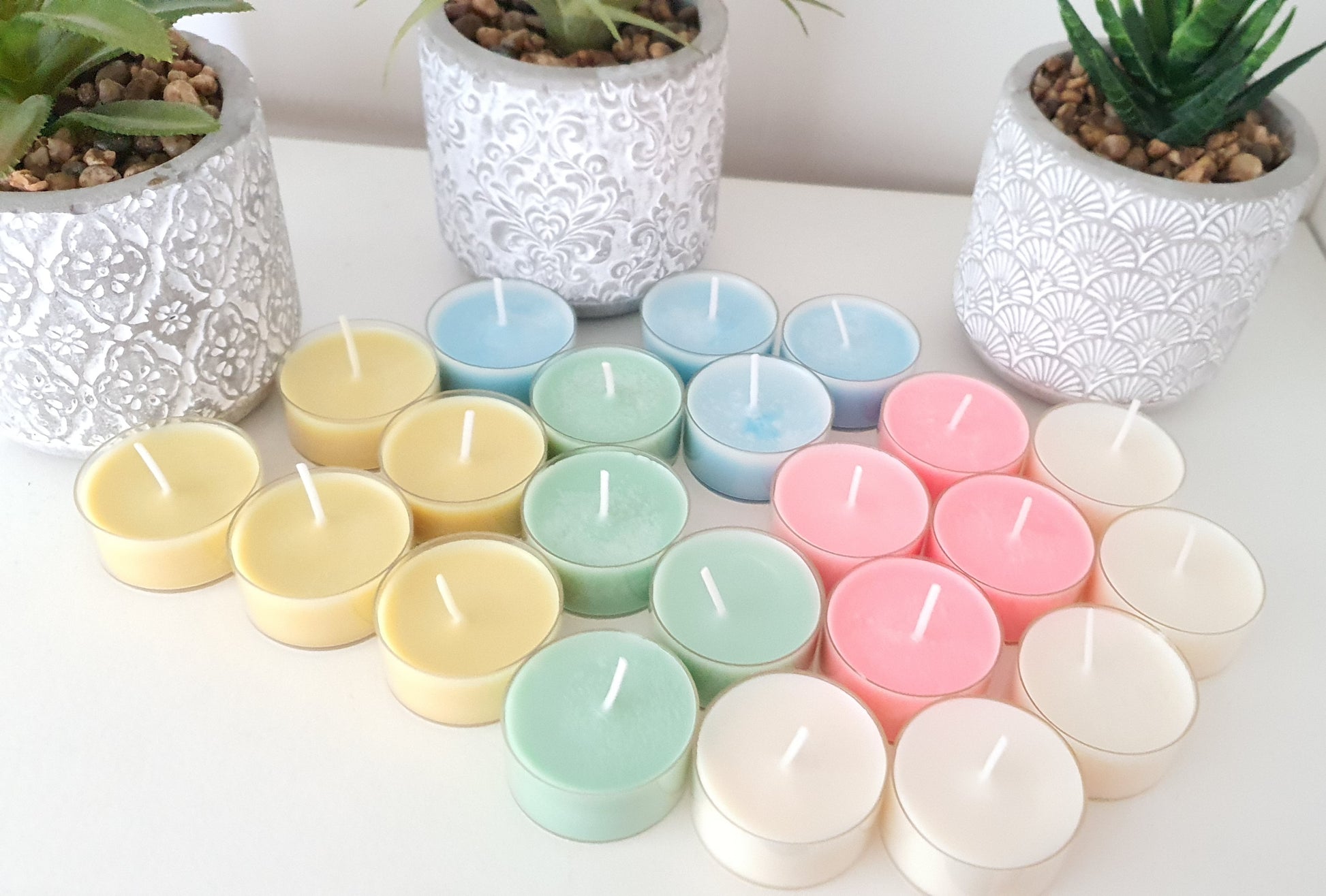 Assorted pastel-colored candles 