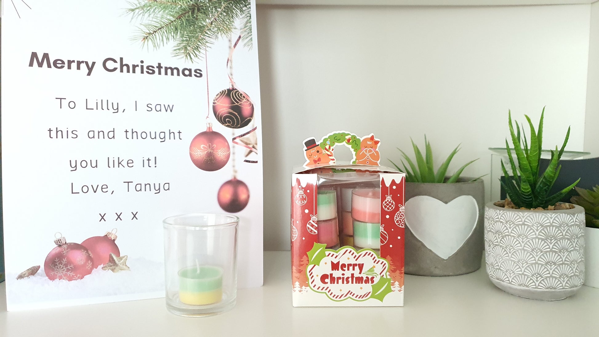 Christmas-themed gift box with candles 